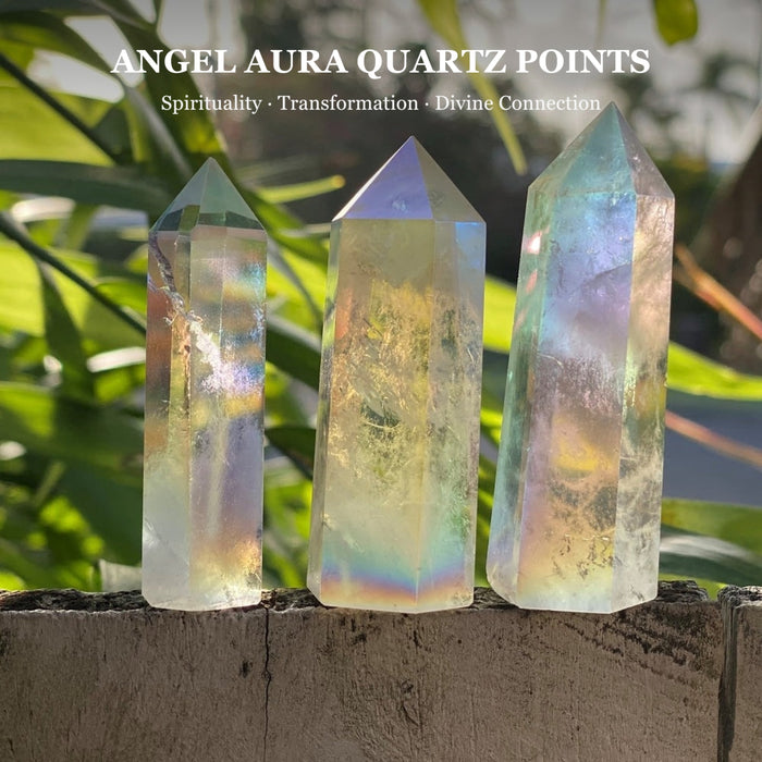 Three angel aura quartz points with a rainbow sheen