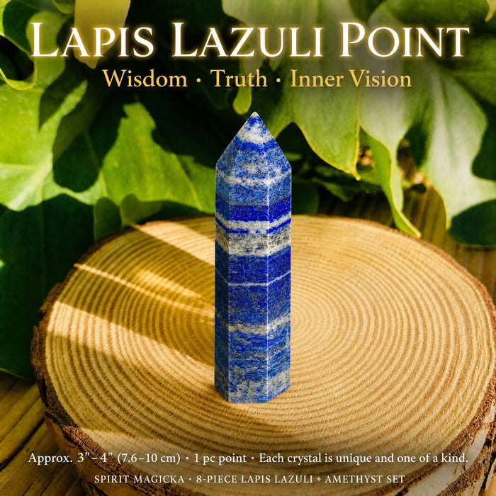 The lapis lazuli point standing upright on a wood slice, deep blue with white veins and gold pyrite flecks