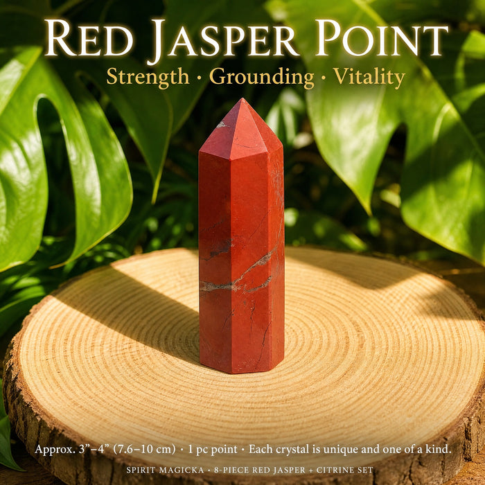 A polished six-sided red jasper point standing on a wooden slice