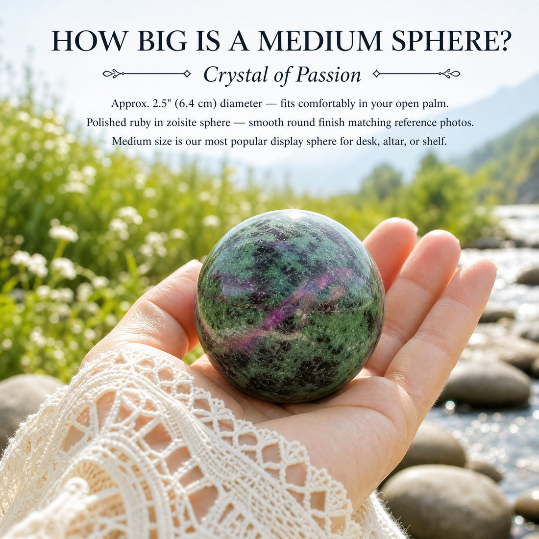 A polished ruby in zoisite sphere, green with black flecks and a magenta ruby swirl, resting in an open palm