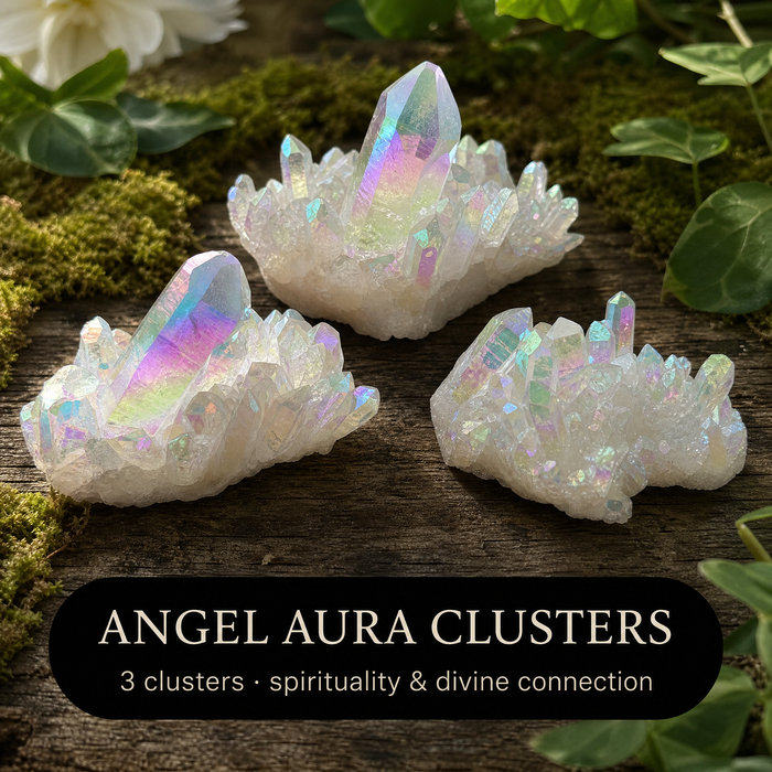 Three iridescent angel aura quartz clusters on moss