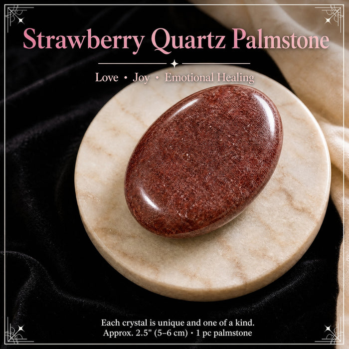 Speckled red strawberry quartz palmstone on a marble dish