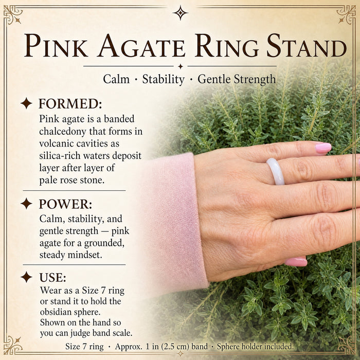The pale pink agate ring worn on a hand