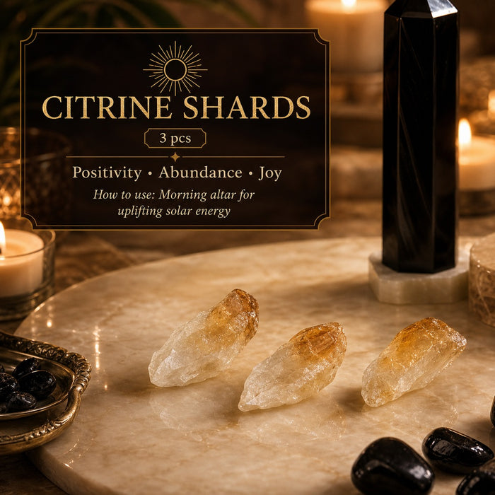 Three golden rough citrine shards on marble