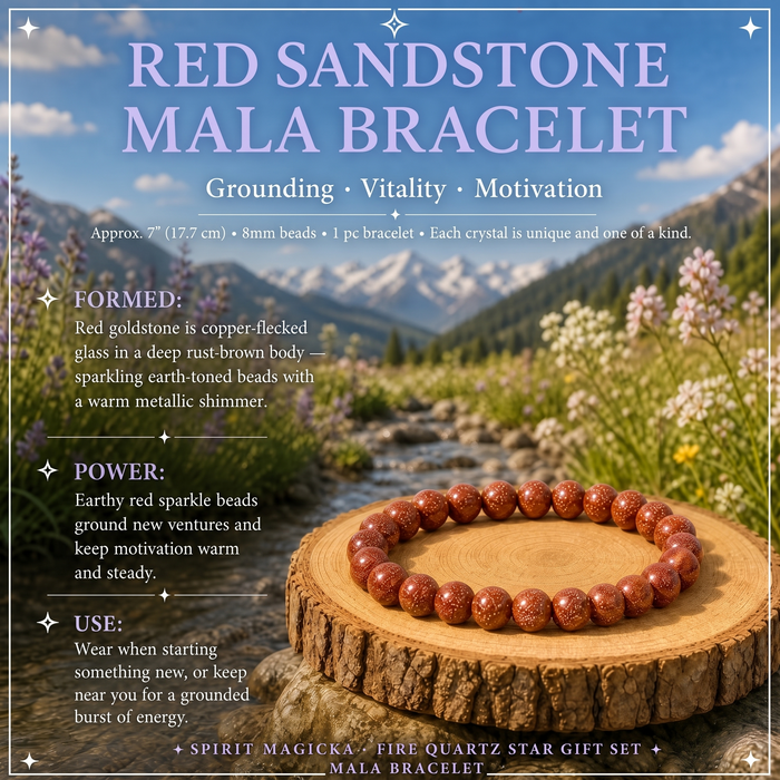 A coppery red sandstone bead bracelet with a warm metallic shimmer on a wood slice