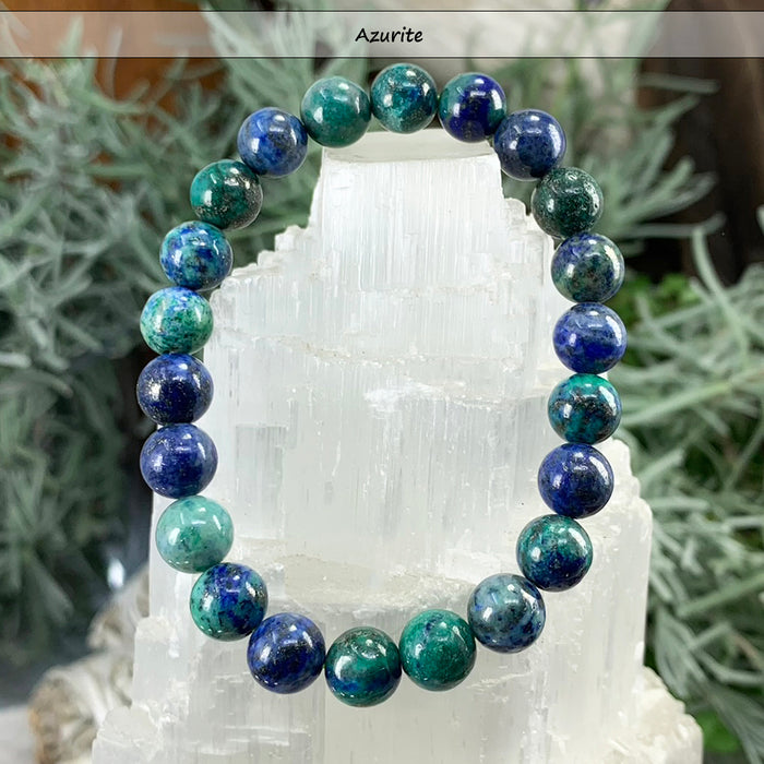 Deep blue and green azurite bead bracelet on a selenite tower
