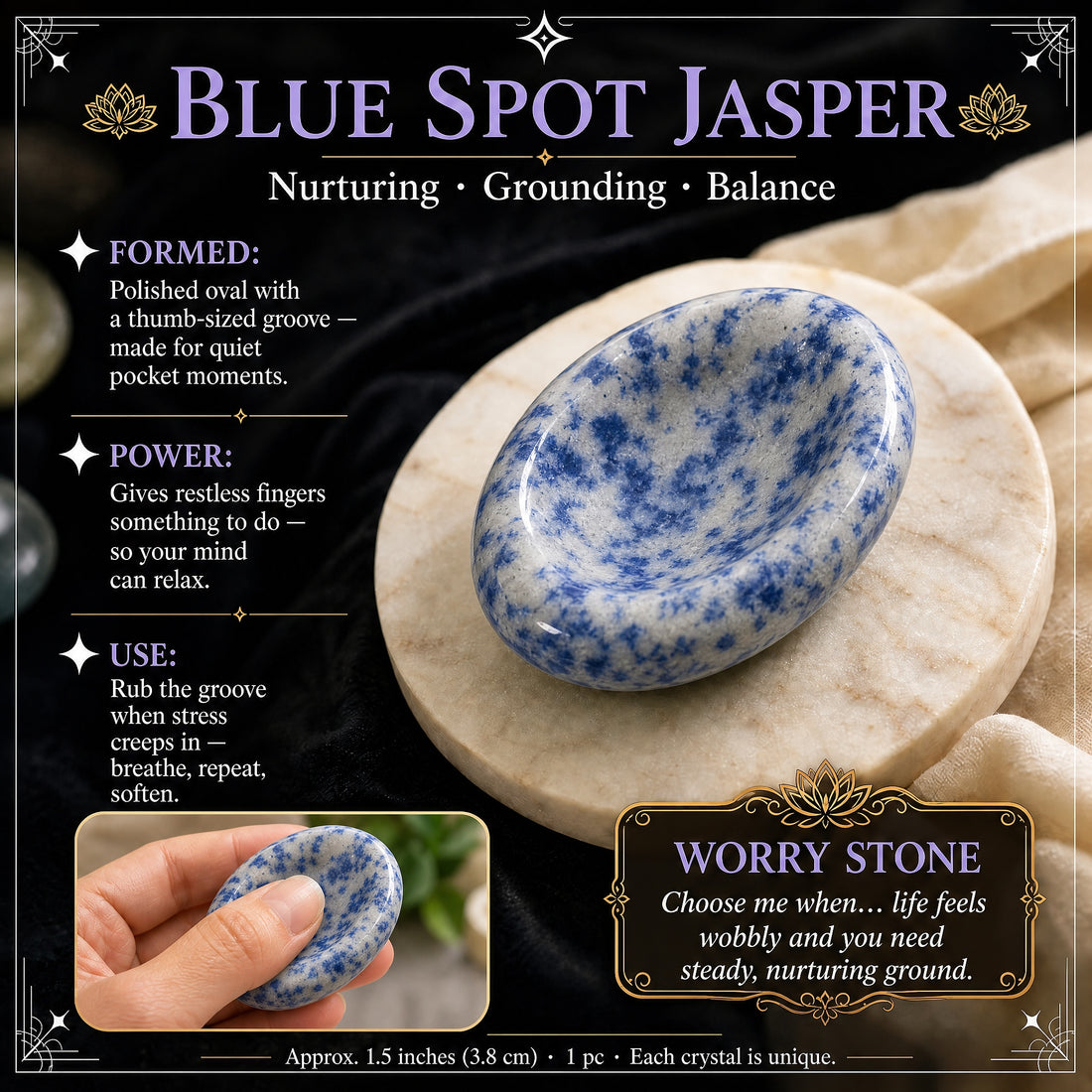 Polished blue spot jasper worry stone, pale grey speckled with blue, on a marble coaster, with an inset of a thumb resting in its oval groove