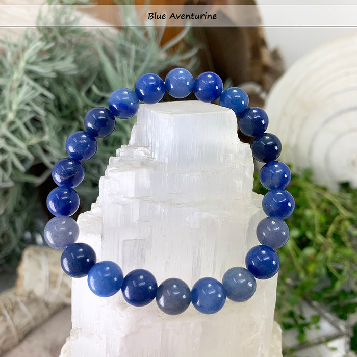 Deep blue aventurine bead bracelet on a selenite tower