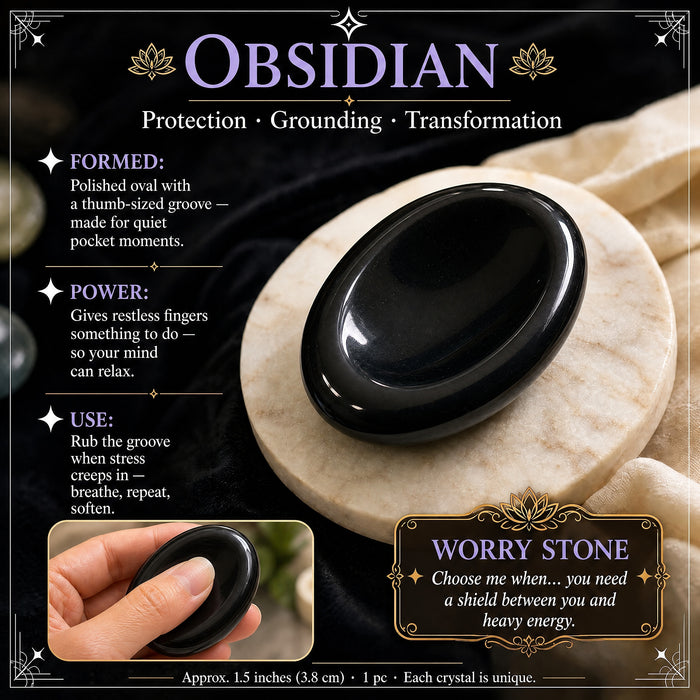 Obsidian worry stone: glossy black, with a thumb groove